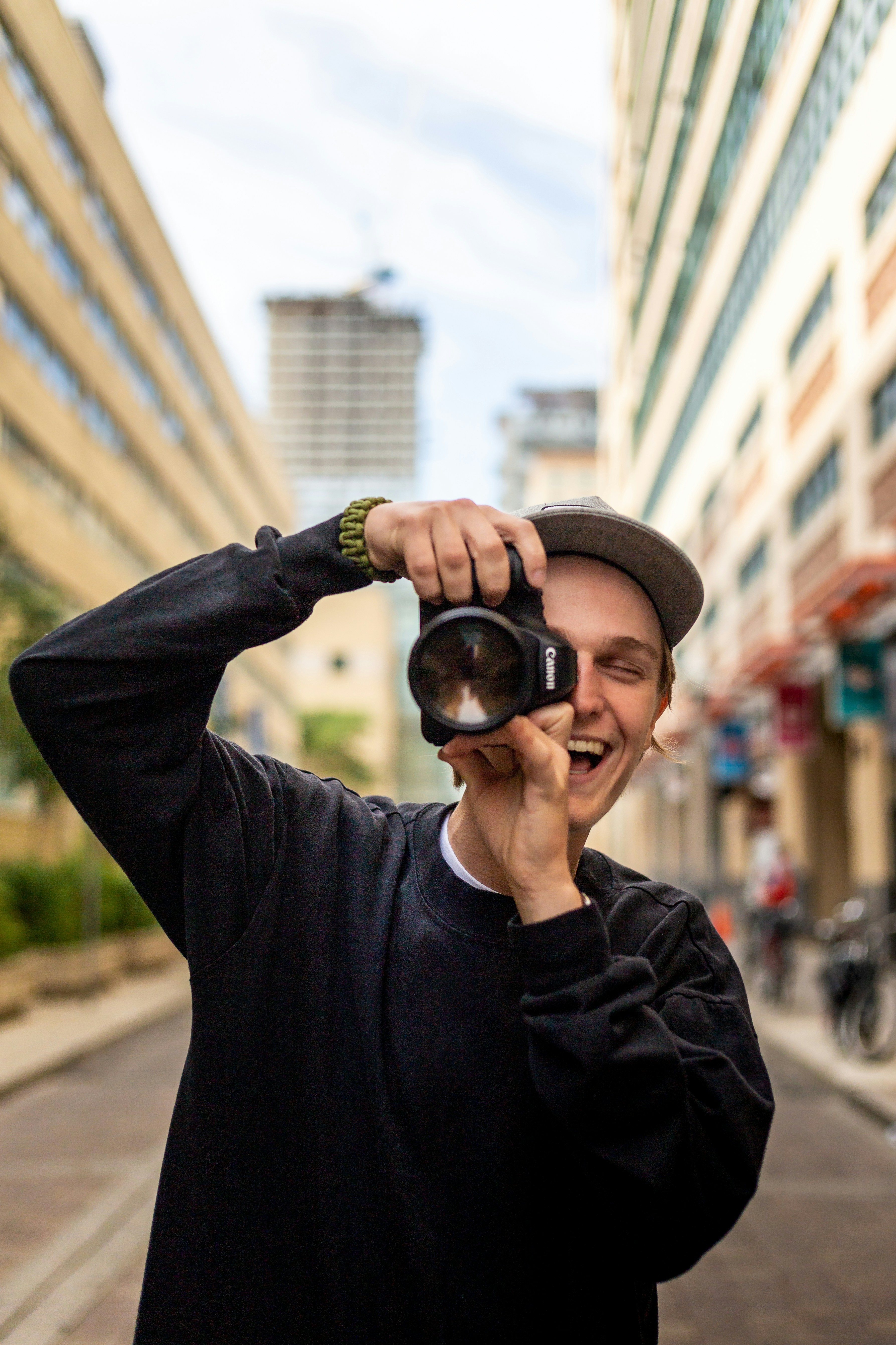 Guy photographer in the city by Venrick Azcueta